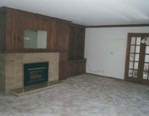 Main floor living room room. 
Huge picture window with view of valley.
Gas fireplace.
